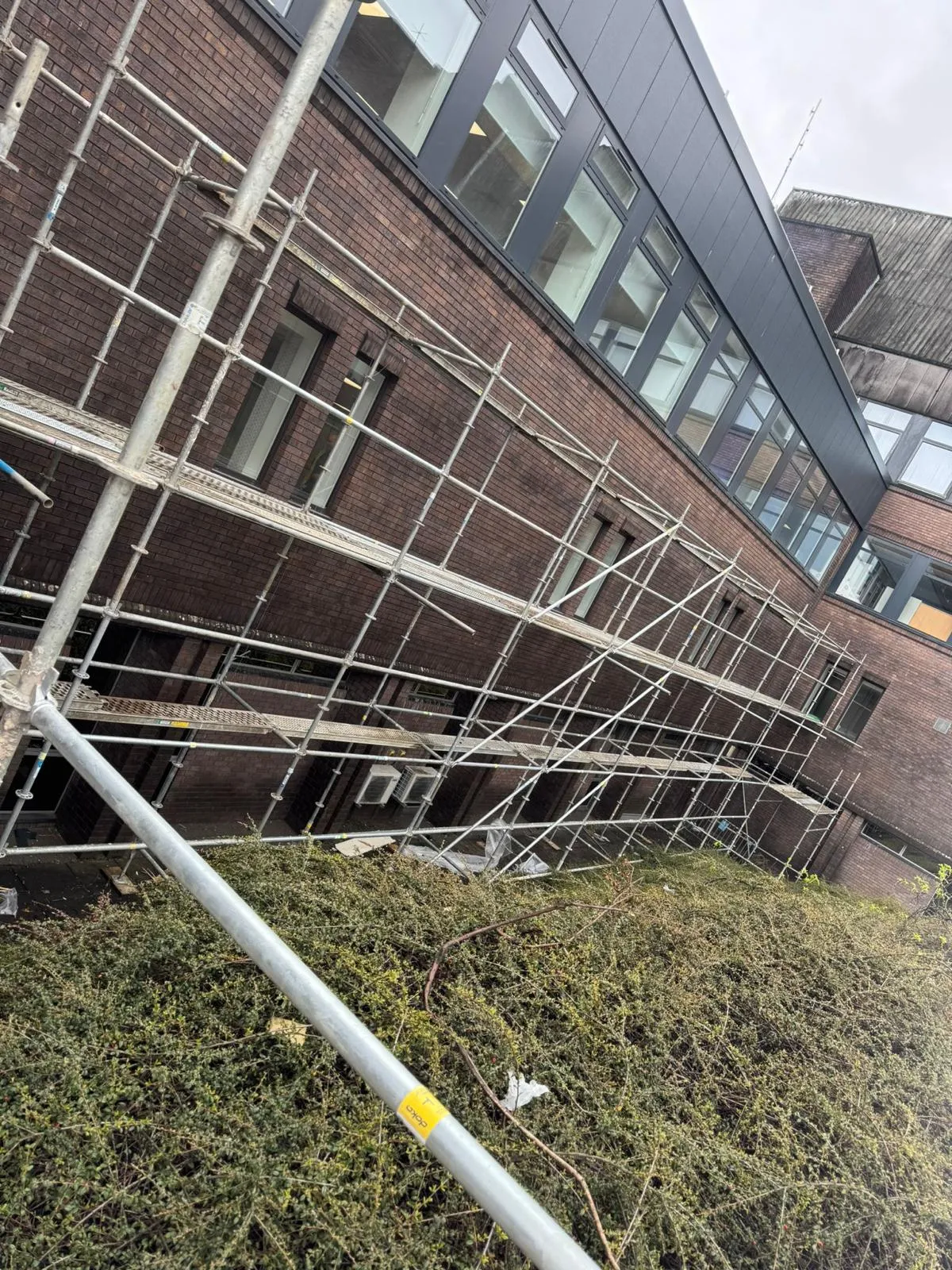 Scaffolding along the brick elevation of an office building